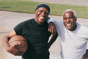Two men playing basketball