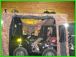 Kid on a hunting utility vehicle