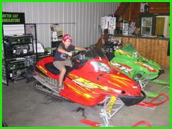 Kid on a snowmobile