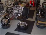Swivel Chair sittin on a  22" Giovanna Wheel with 255/30/22 Nexen Tire lifted 2 feet