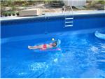 She couldn't wait for the Pool to Fill Up!