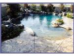 Beach enry, rock waterfalls, raised spa with rock spillway