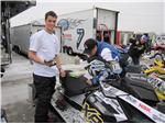 Darrin Mees helping his mechanic